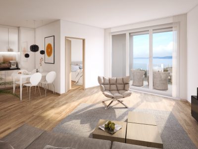 Moderan dnevni i blagovaonički prostor otvorenog plana sa svijetlim drvenim podom, kuhinjom, staklenim vratima koja vode na balkon s pogledom na more, dok je spavaća soba vidljiva kroz otvorena vrata.